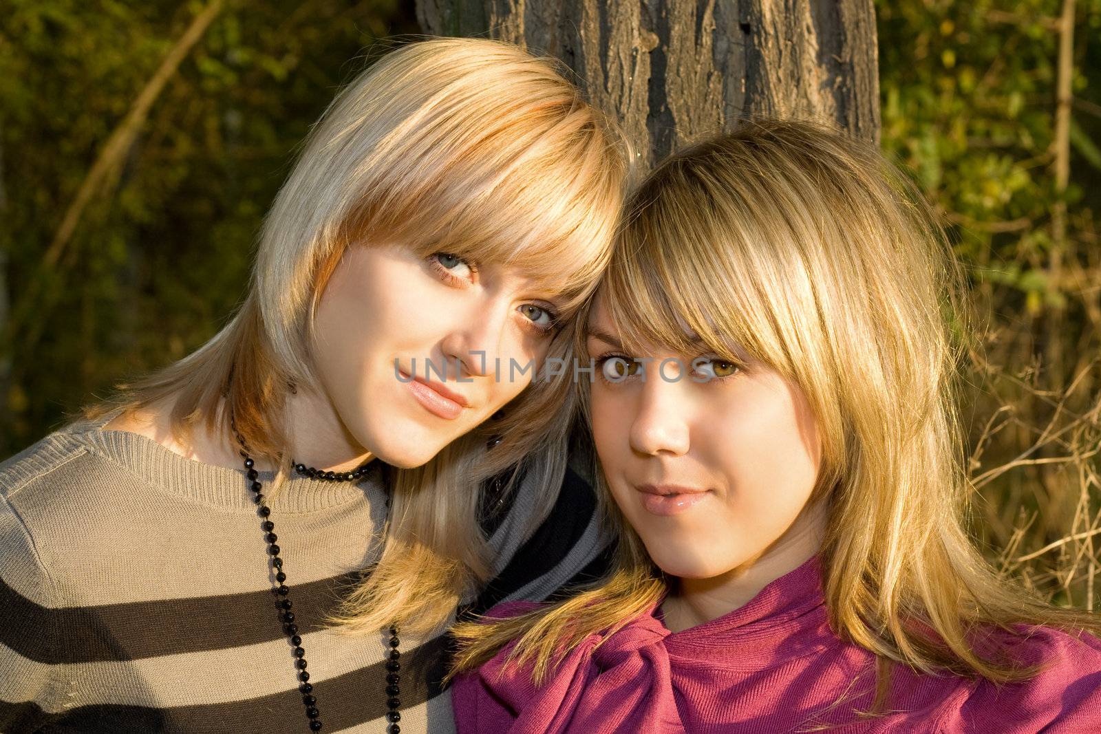Portrait of the two young women outdoors