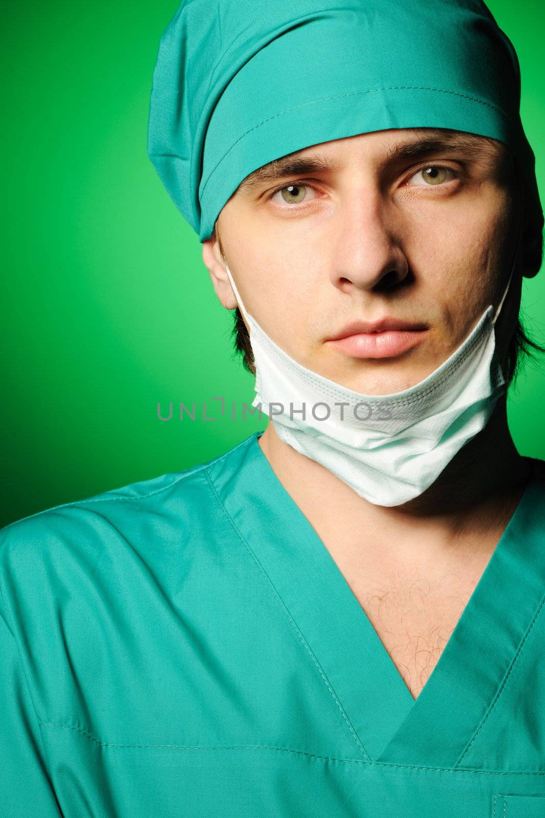 Surgeon with mask over green