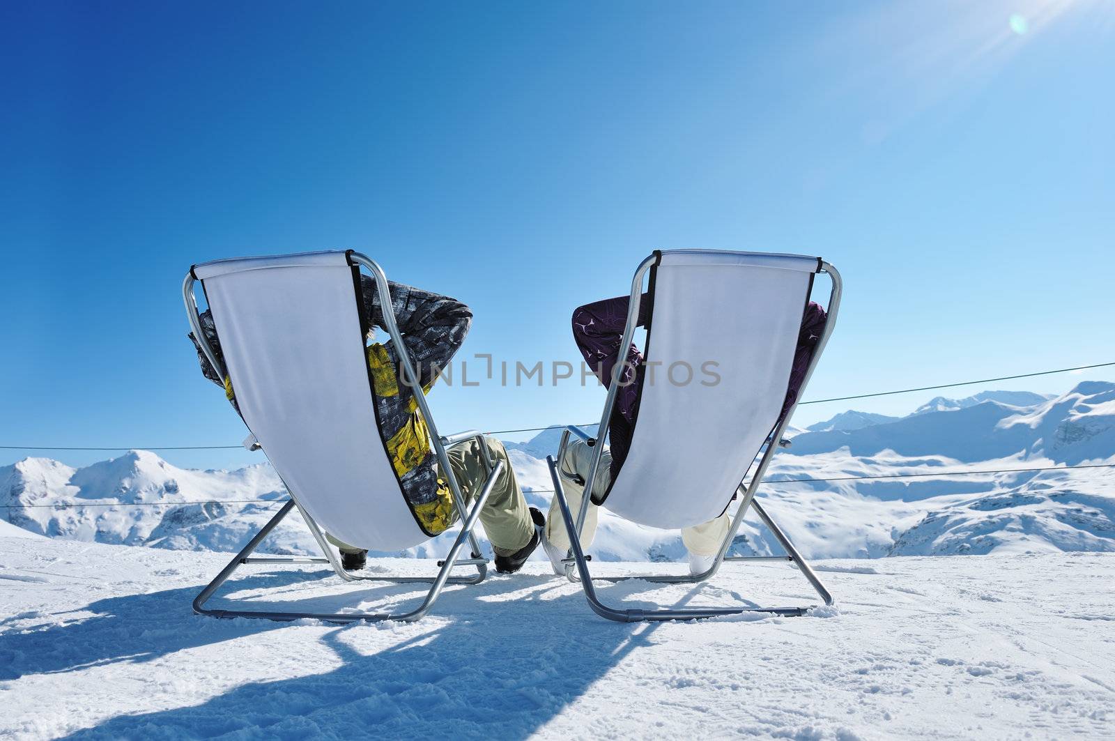 Couple at mountains in winter, Val-d'Isere, Alps, France