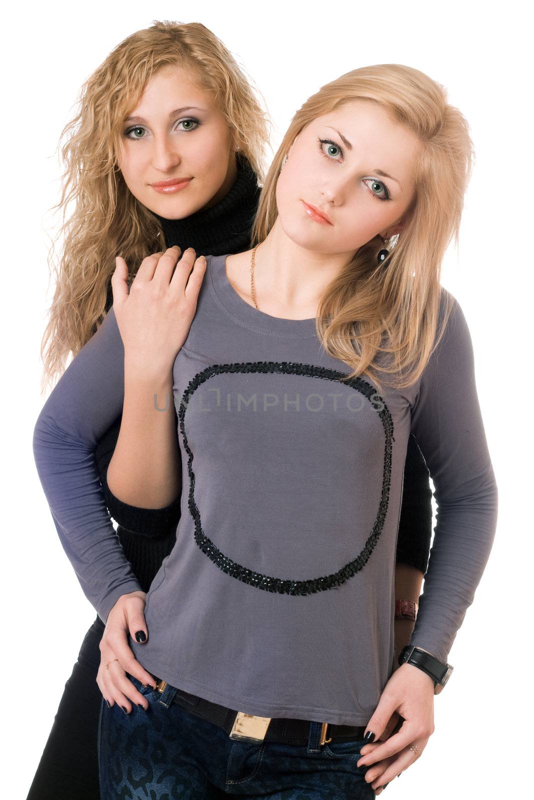 Portrait of two pretty young women. Isolated