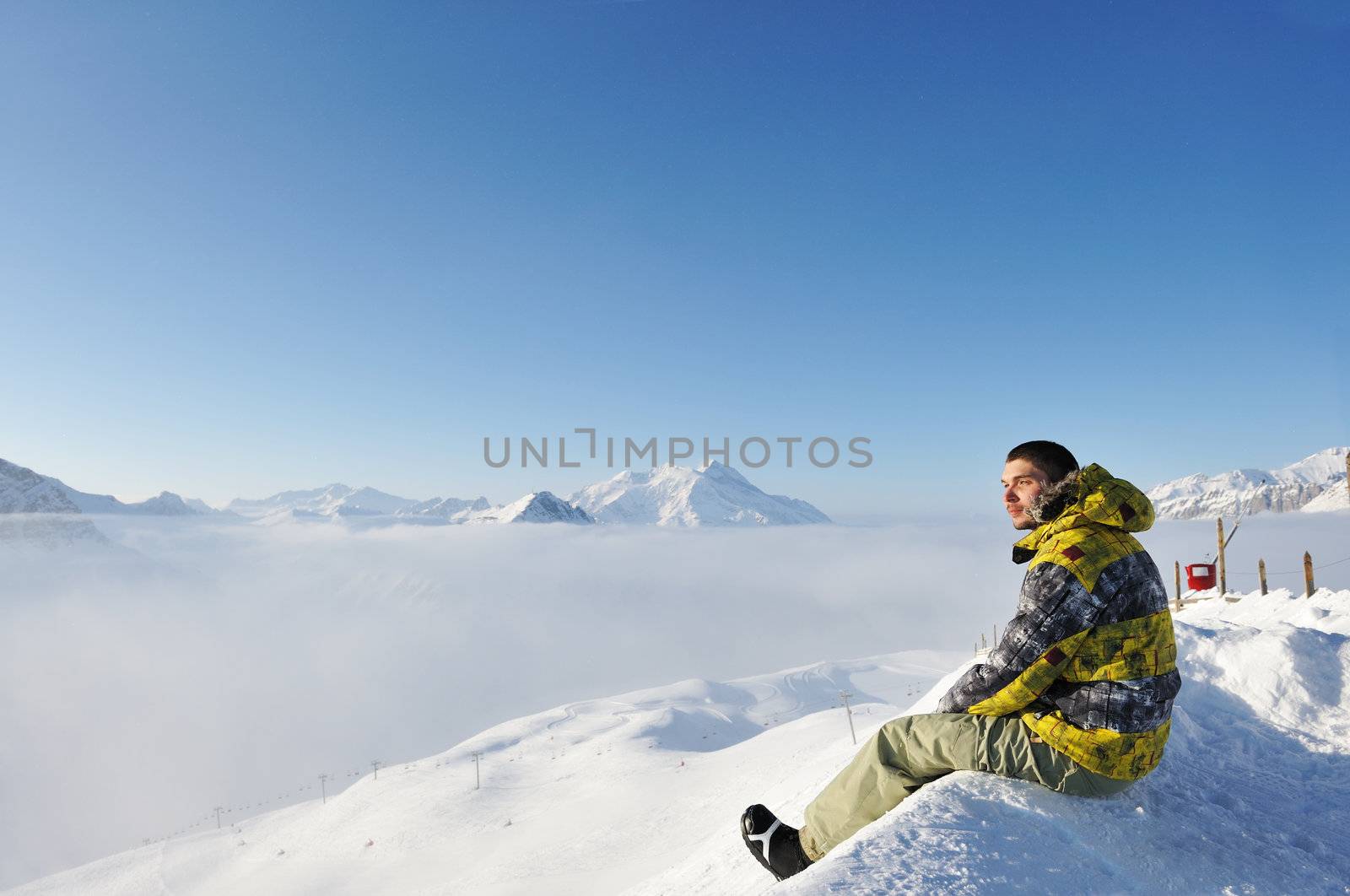 Man at mountains in clouds, Val-d'Isere, Alps, France