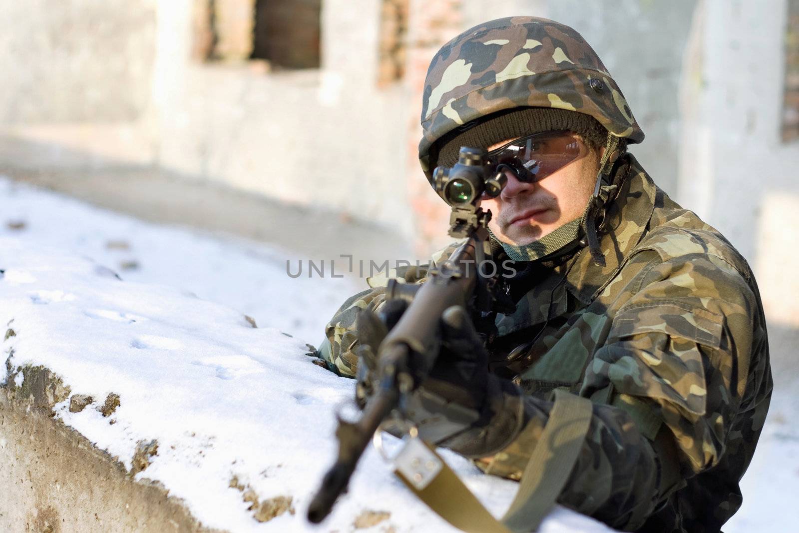 Soldier who aim at his victim from the ambush