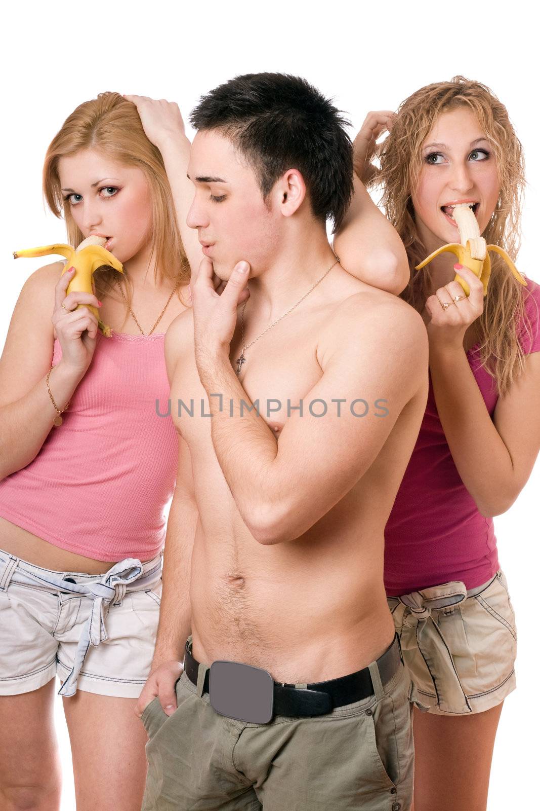 Young man and two playful women with bananas by acidgrey