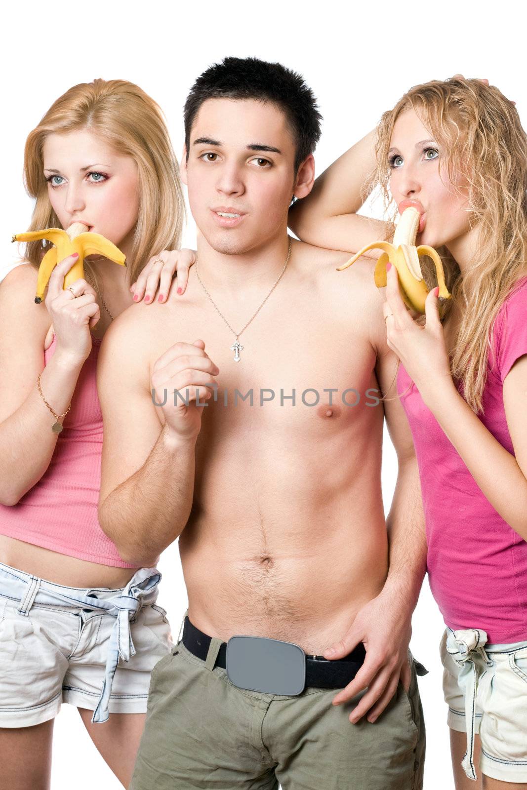 Young man and two attractive women with bananas. Isolated