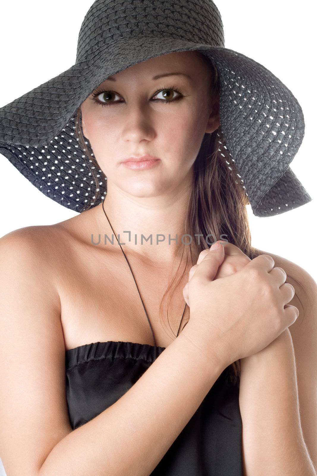 Portrait of beautiful woman in black hat. Isolated