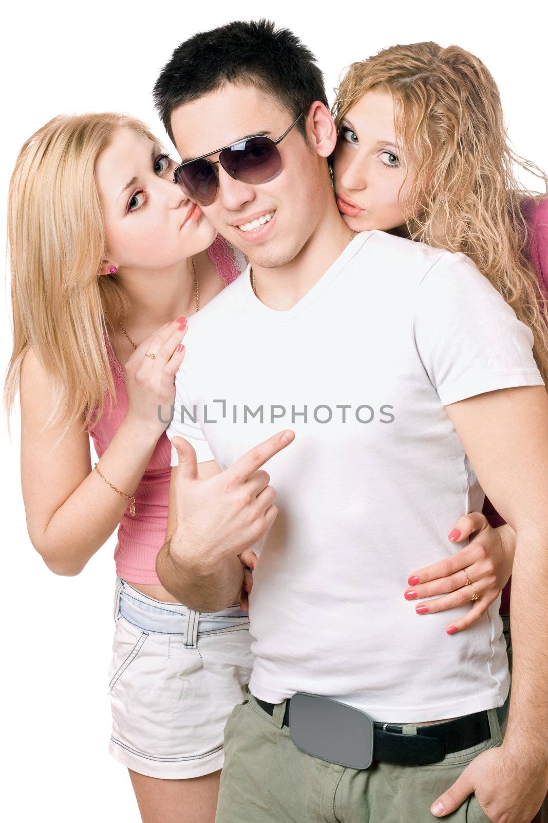 Two attractive blonde kissing handsome young man