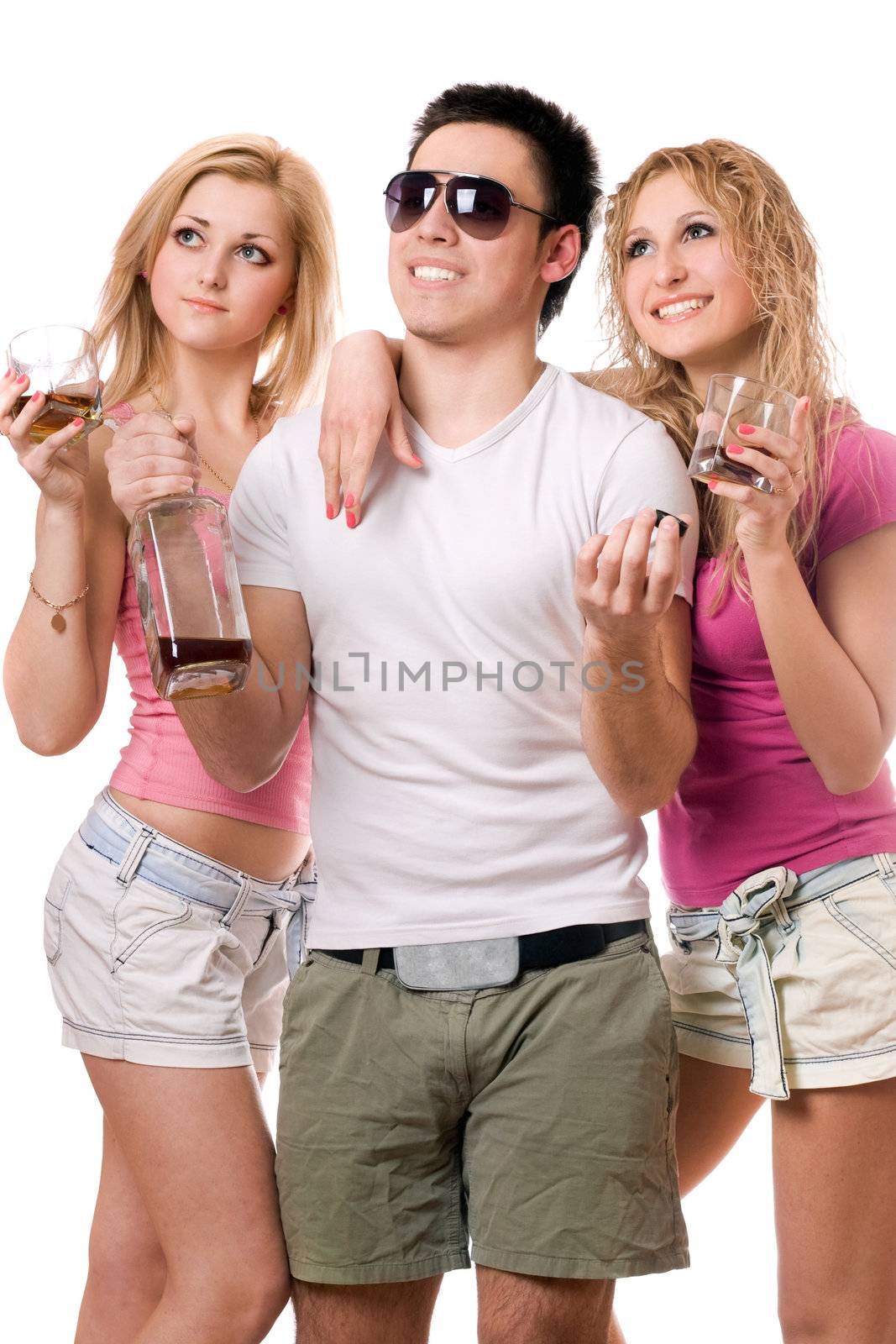 Two smiling blonde woman and young man with a bottle