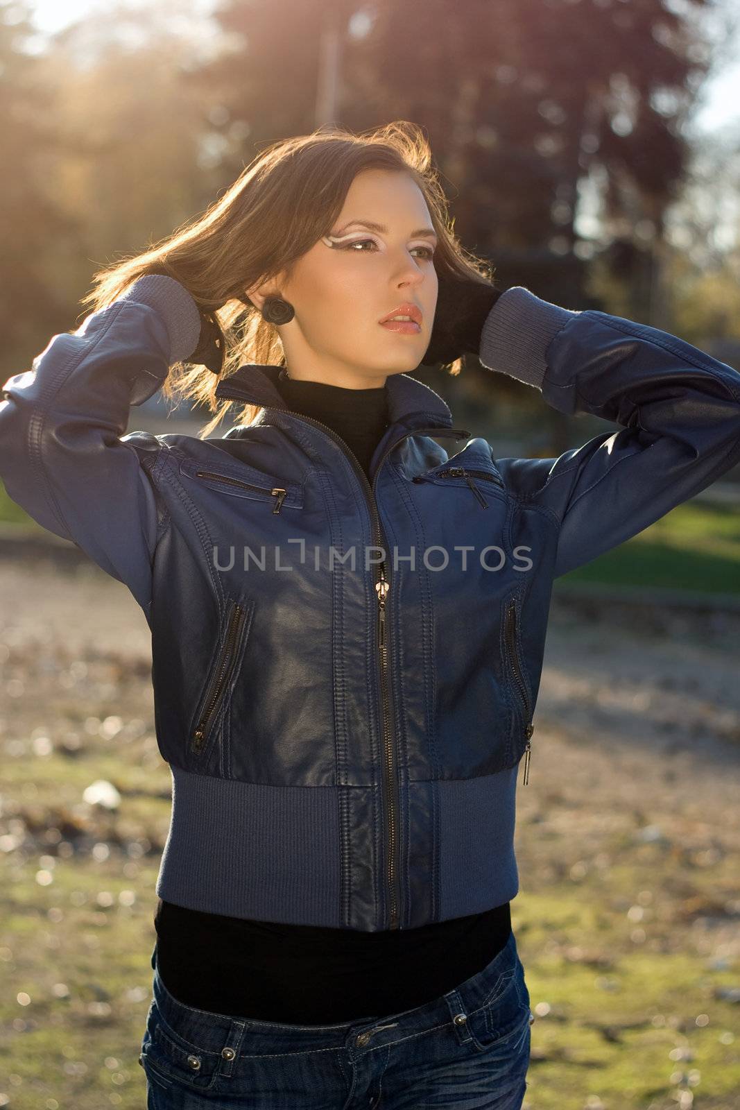 Portrait of a charming girl in autumn park