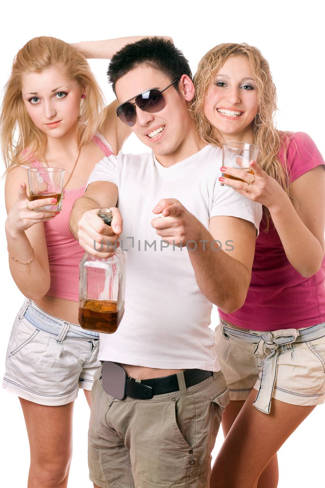 Happy young people with a bottle of whiskey. Isolated