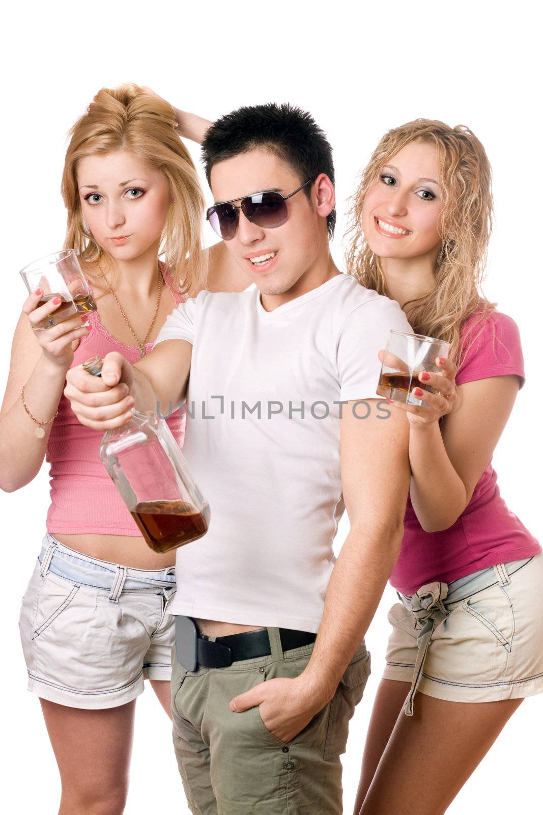 Cheerful young people with a bottle of whiskey. Isolated