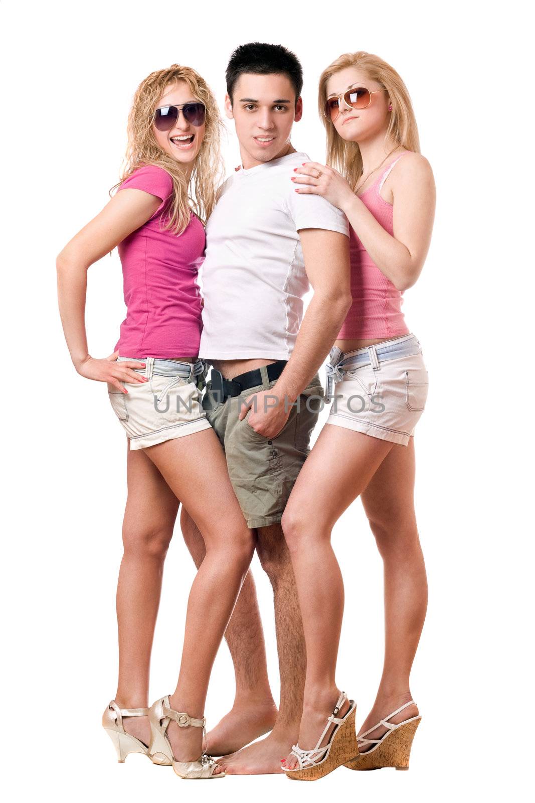 Handsome young man and two girls. Isolated on white