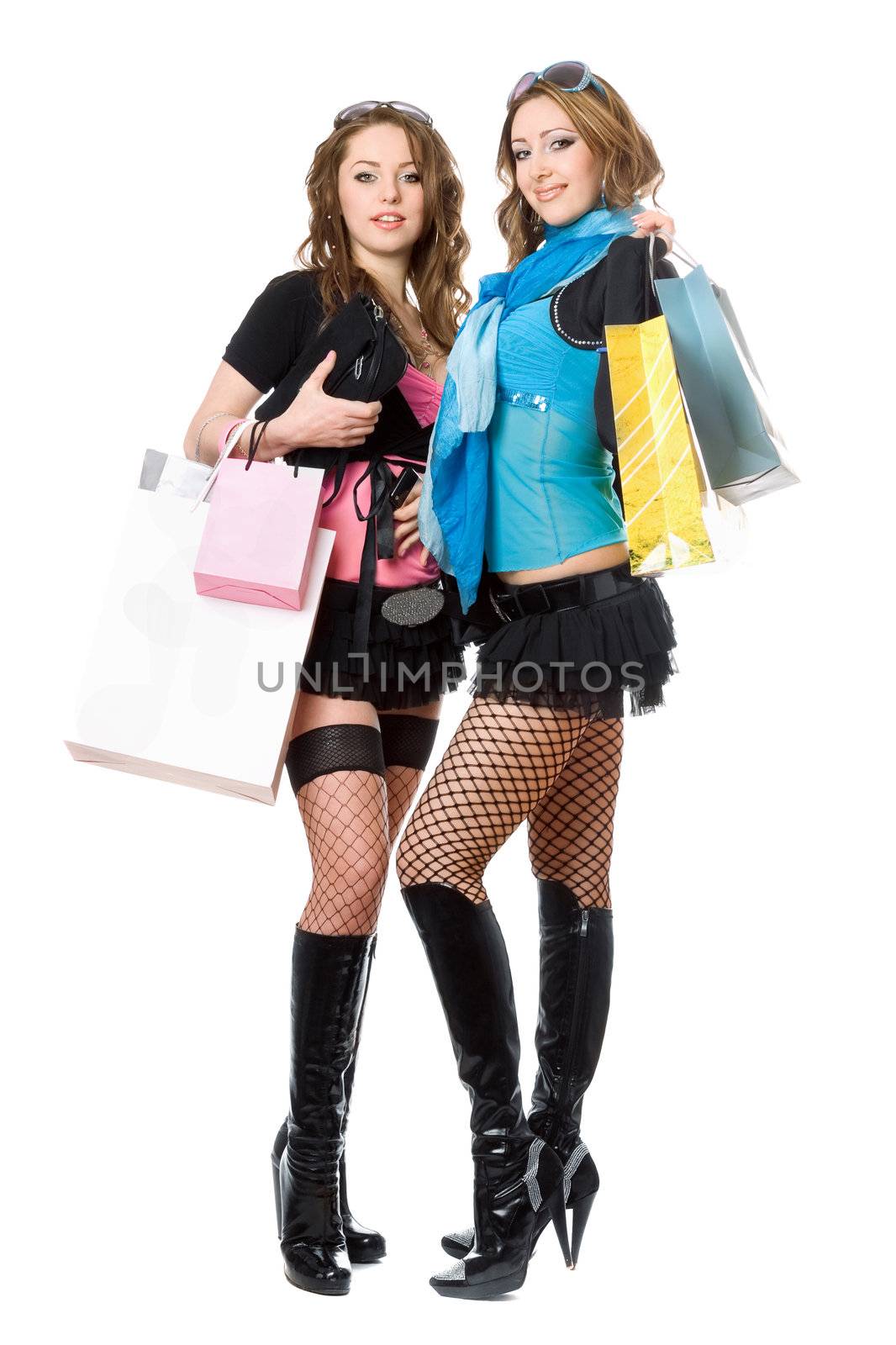 Two beautiful young women after shopping. Isolated