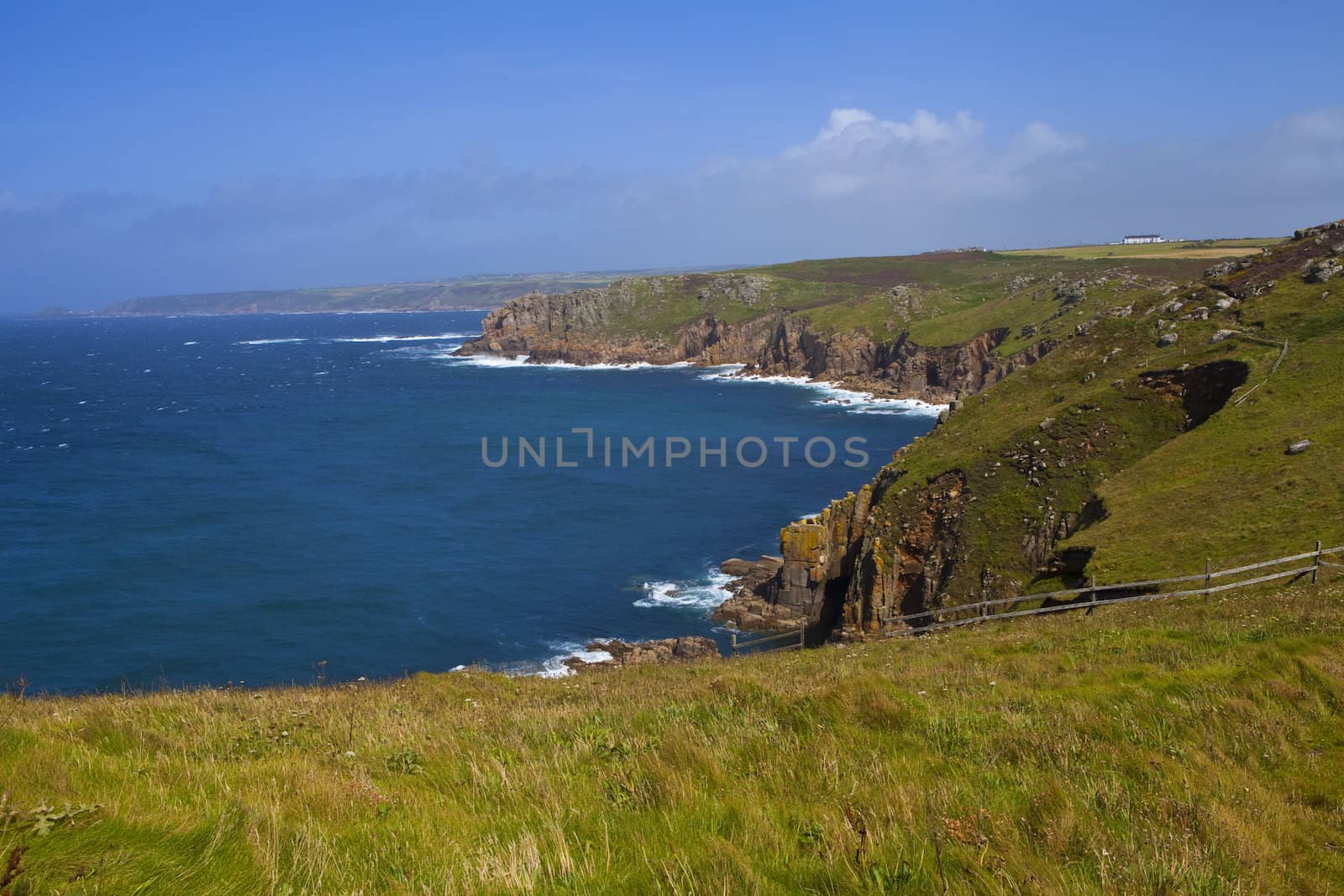 The magnificent view at Land's End in Cornwall, England.  The Trinity House cottages can be seen in the distance.