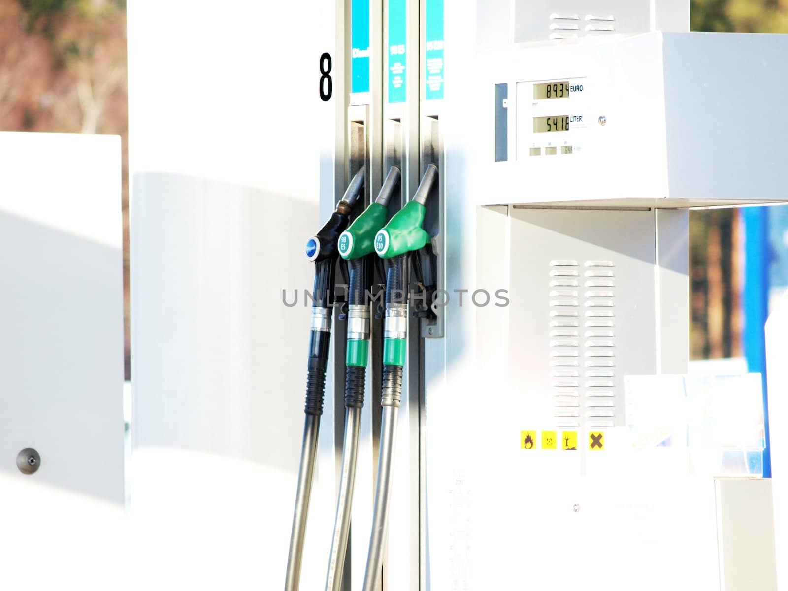 Gas station, closeup of petrol pumps, over white by Arvebettum