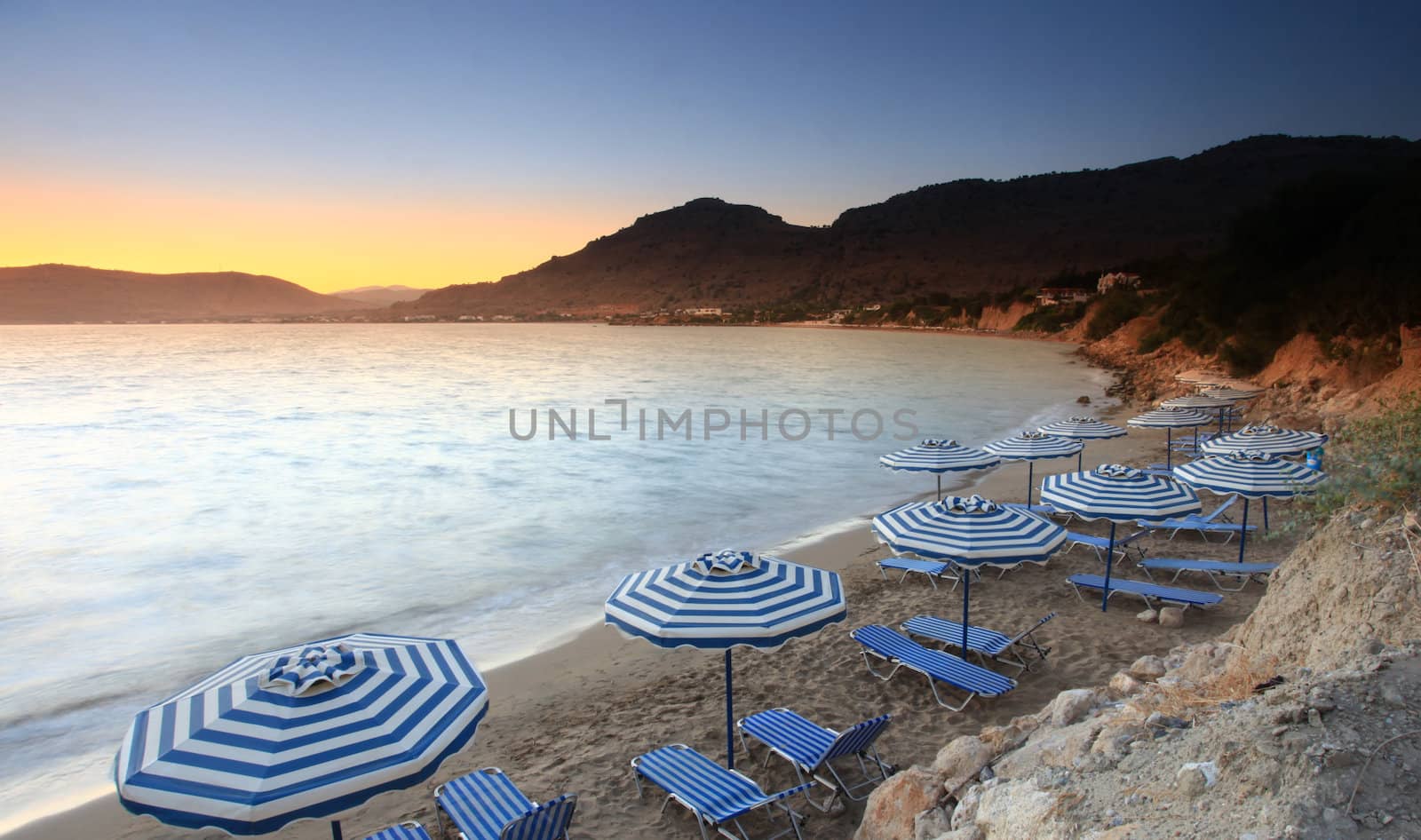 Sunset over Pefkos beach in Rhodes in Greece