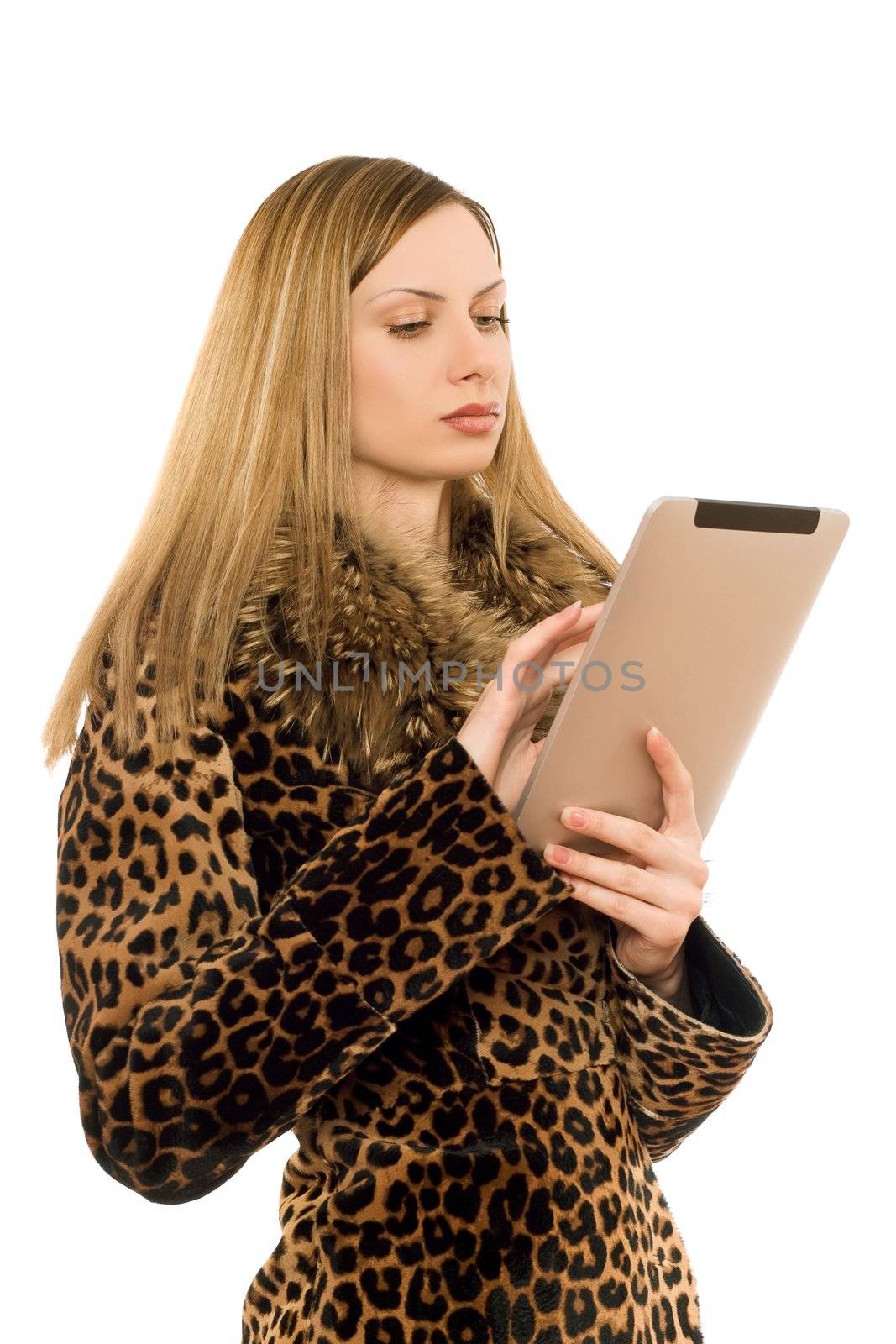 Attractive blonde woman looking at the tablet pc