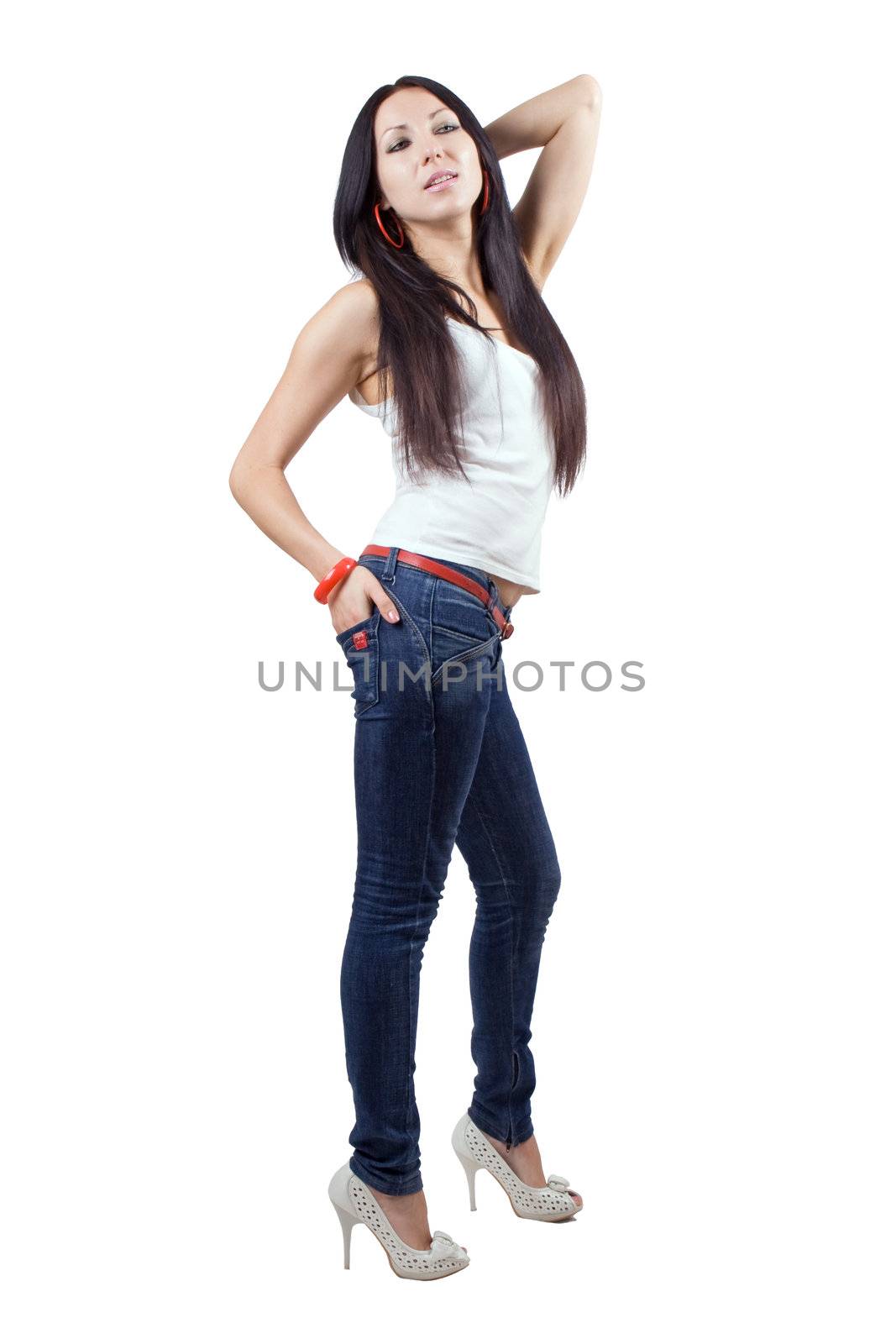 The beautiful young woman in jeans. Isolated