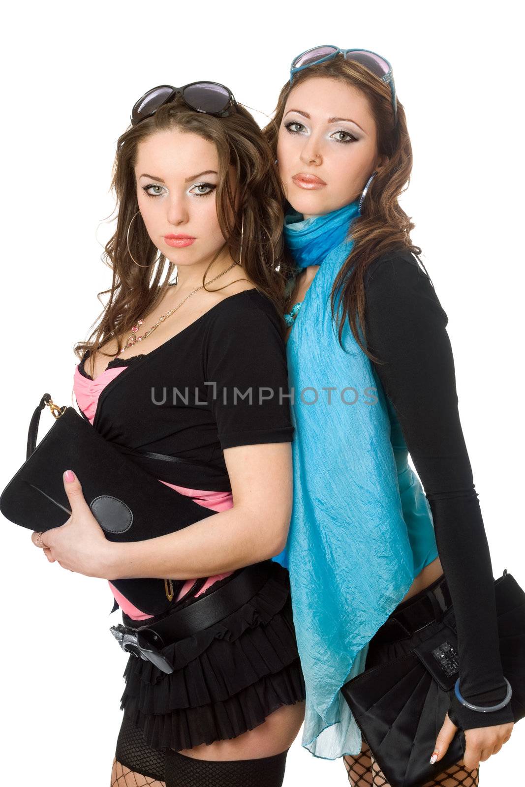 Portrait of two attractive young women. Isolated