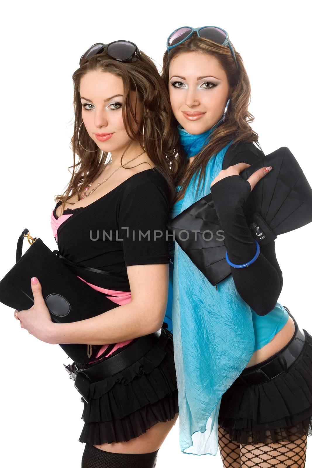 Portrait of two smiling attractive young women. Isolated