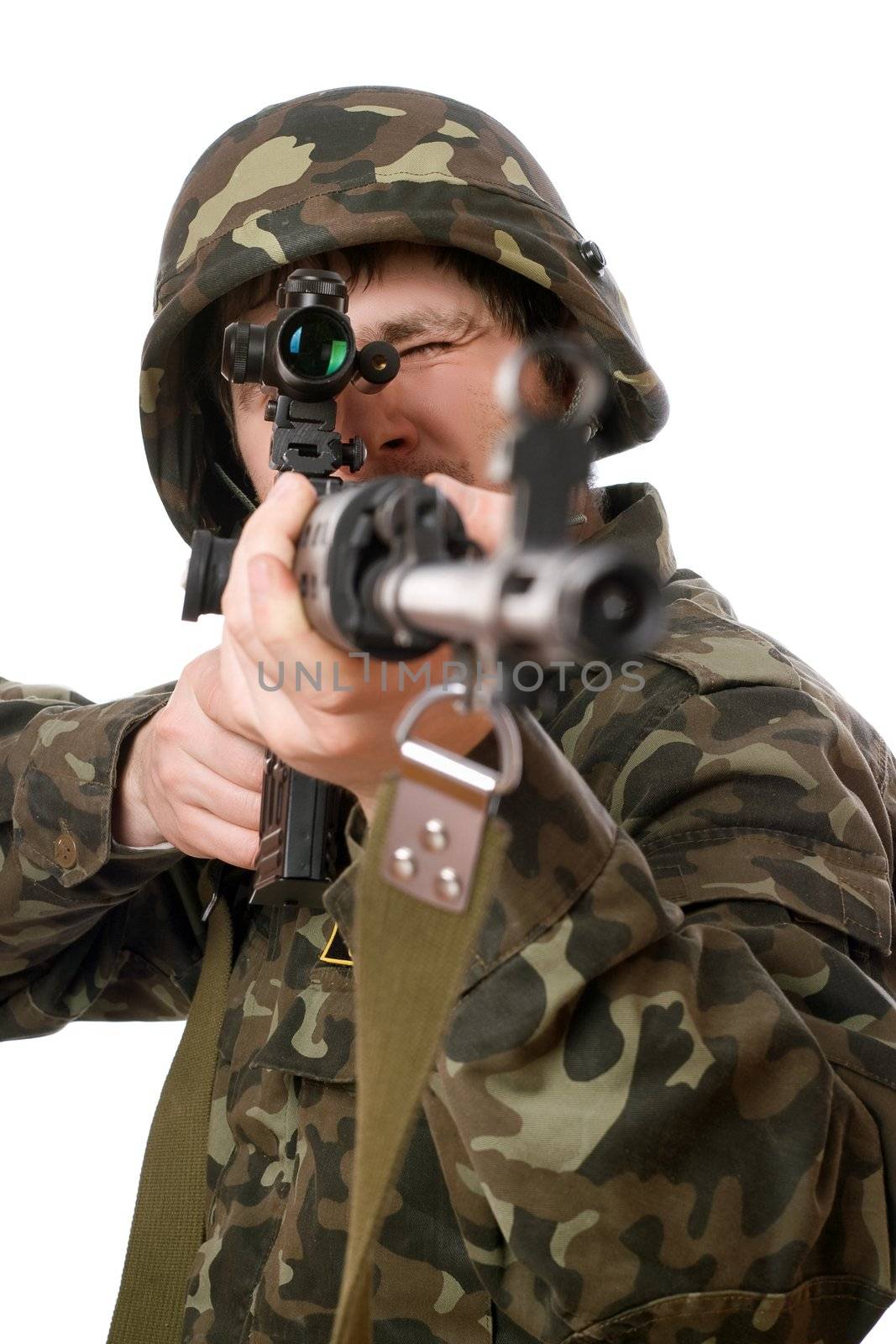 Soldier with a rifle in studio. Isolated