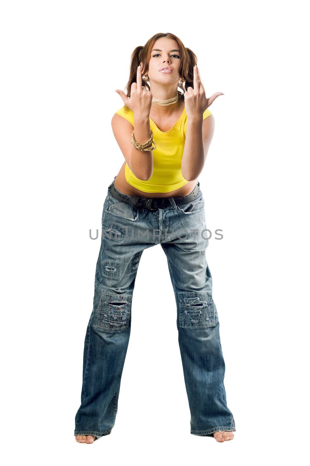 Naughty girl in wide jeans gesturing . Isolated on white