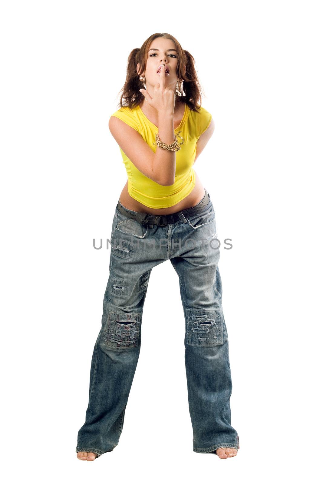 Naughty girl in wide jeans and yellow top. Isolated on white