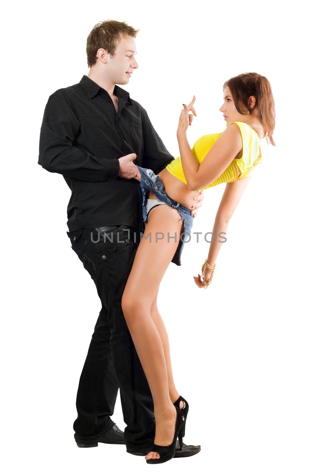 Man flirting with playful young woman in ragged shorts