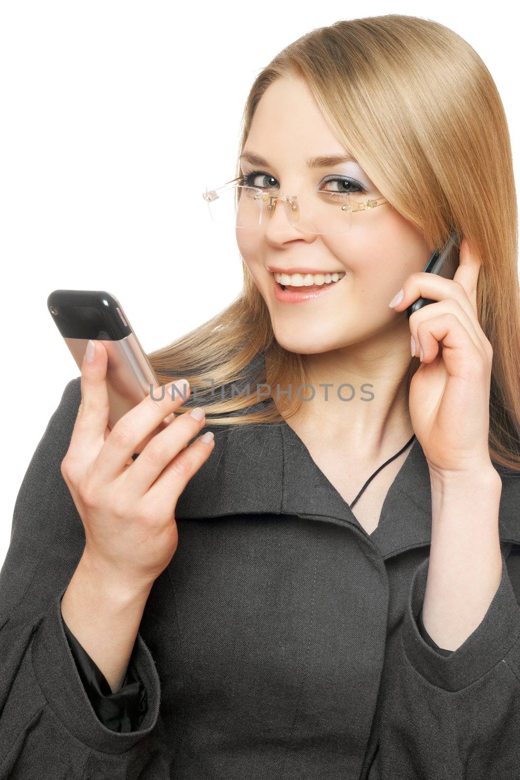 Close-up portrait of smiling young blonde with two phones