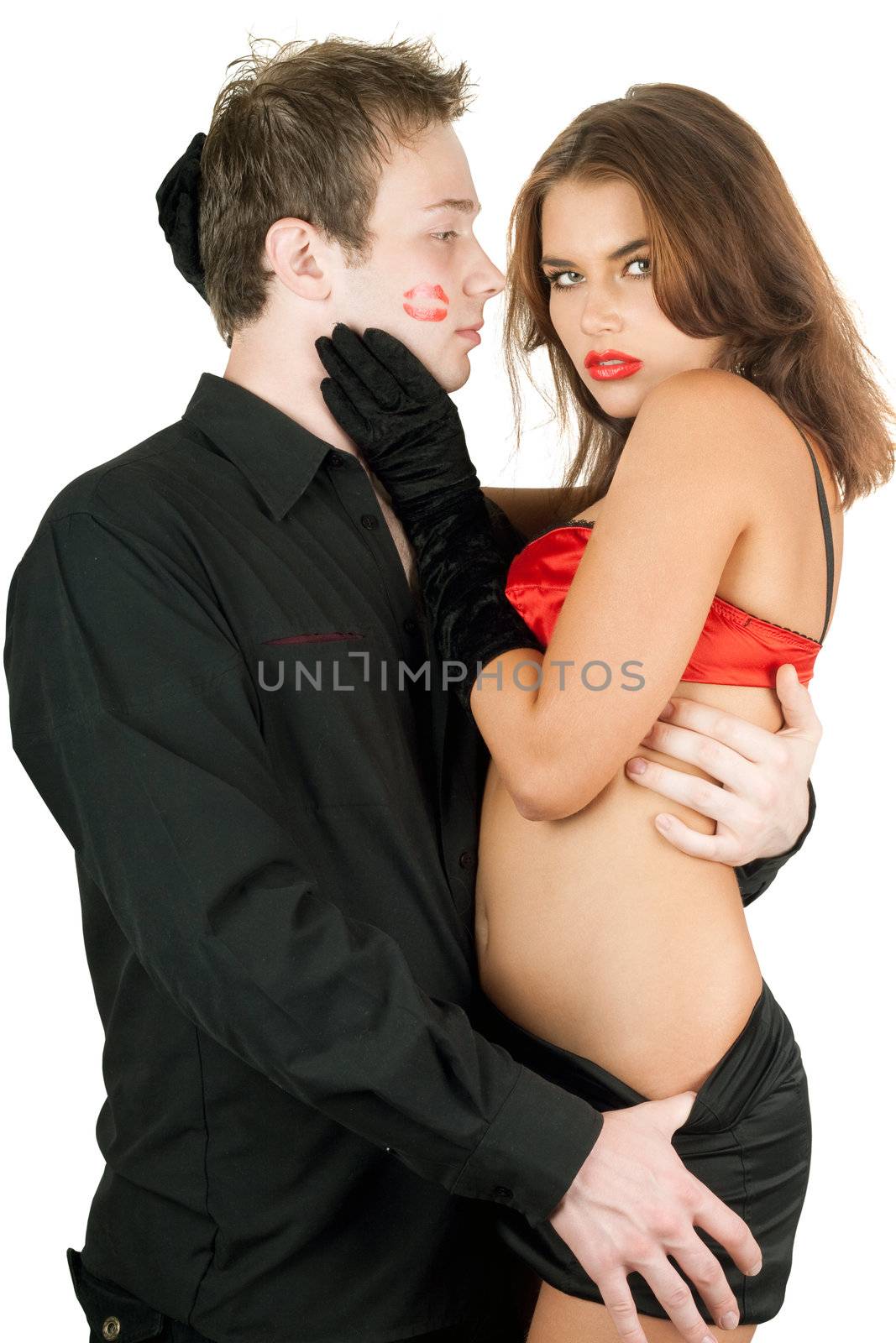 Portrait of the sexy playful young couple. Isolated