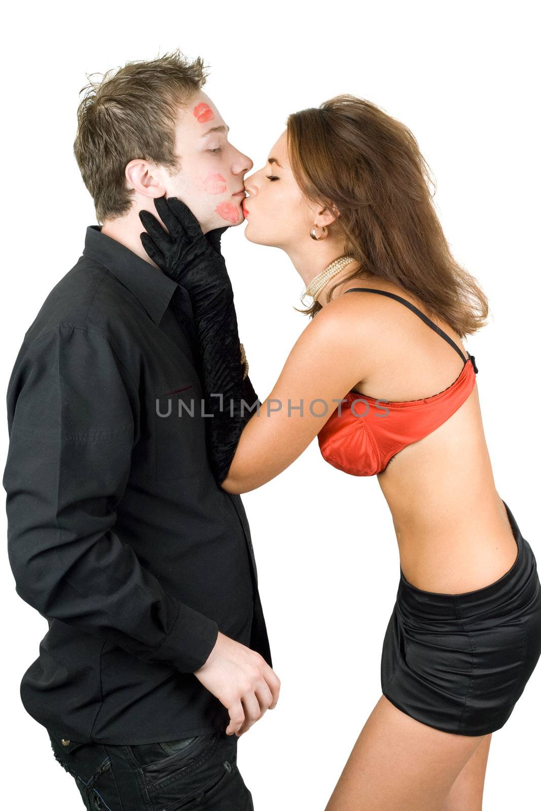 Portrait of young kissing couple. Isolated on white