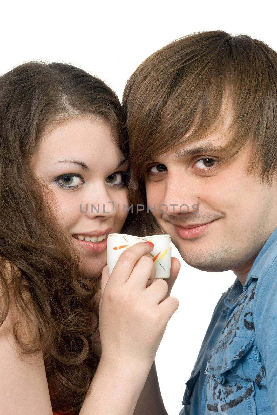 Portrait of young couple with glasses in hands. Isolated