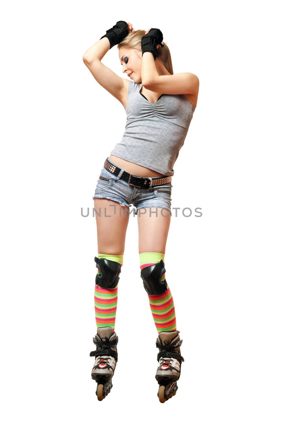 Playful pretty young blonde on roller skates