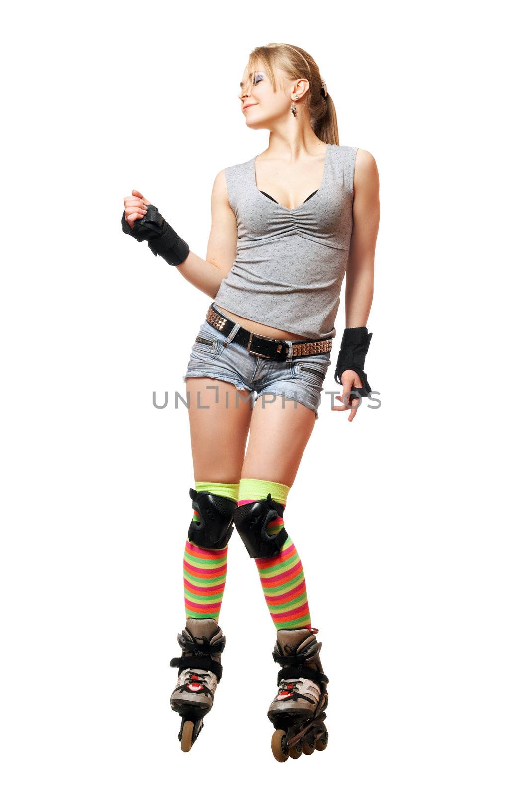 Playful beautiful young woman on roller skates