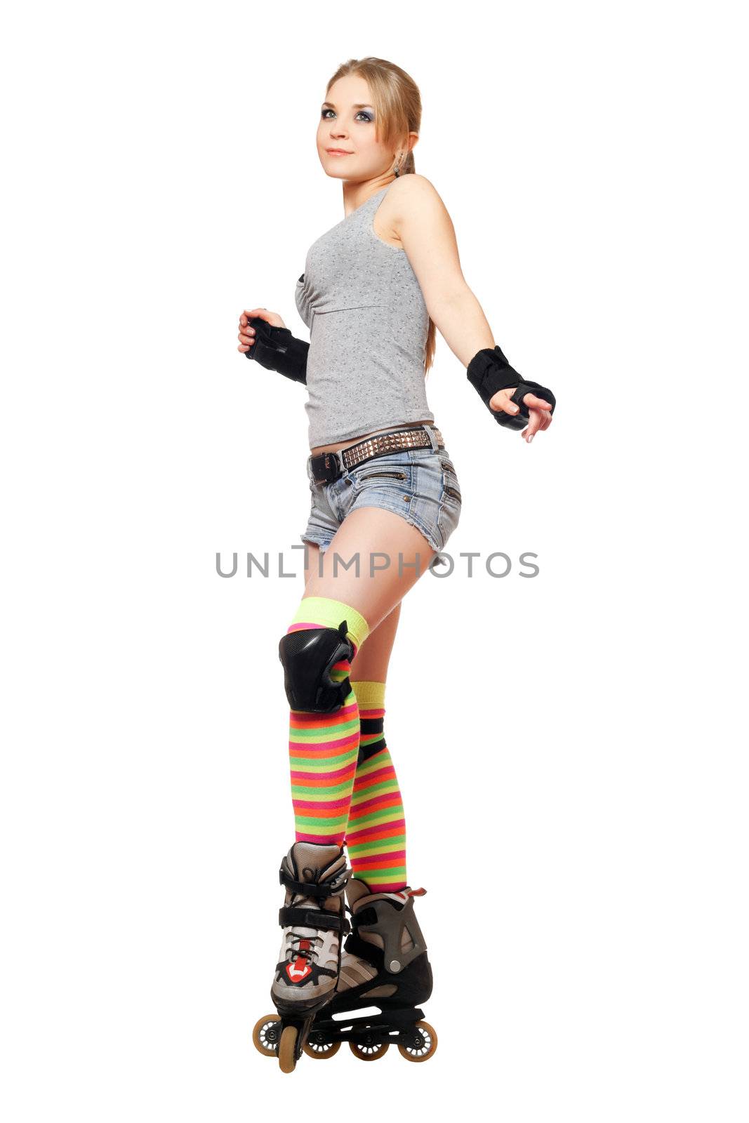Attractive young blonde on roller skates. Isolated