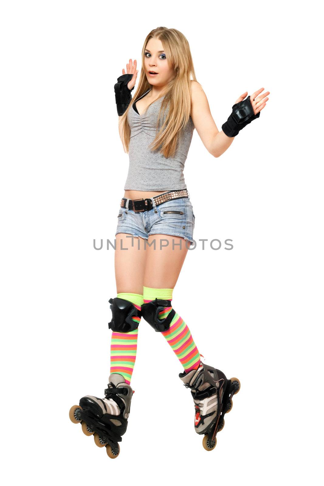 Scared young woman tries to keep his balance on roller skates