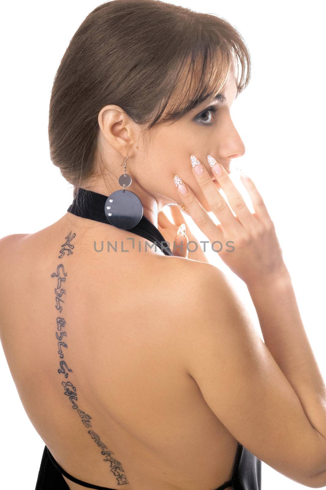 Young woman with a tattoo on her back