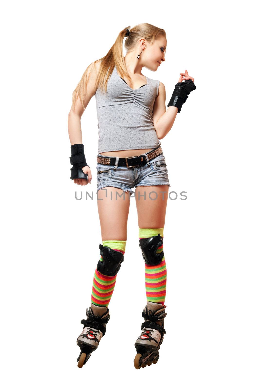 Playful beautiful young blonde on roller skates