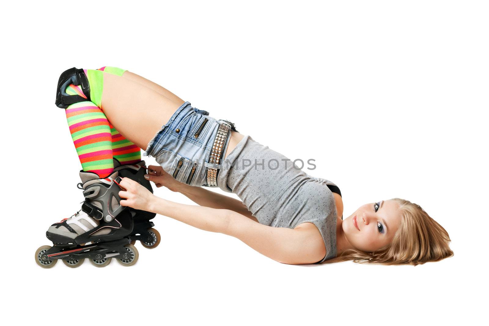 Lying pretty girl in roller skates. Isolated
