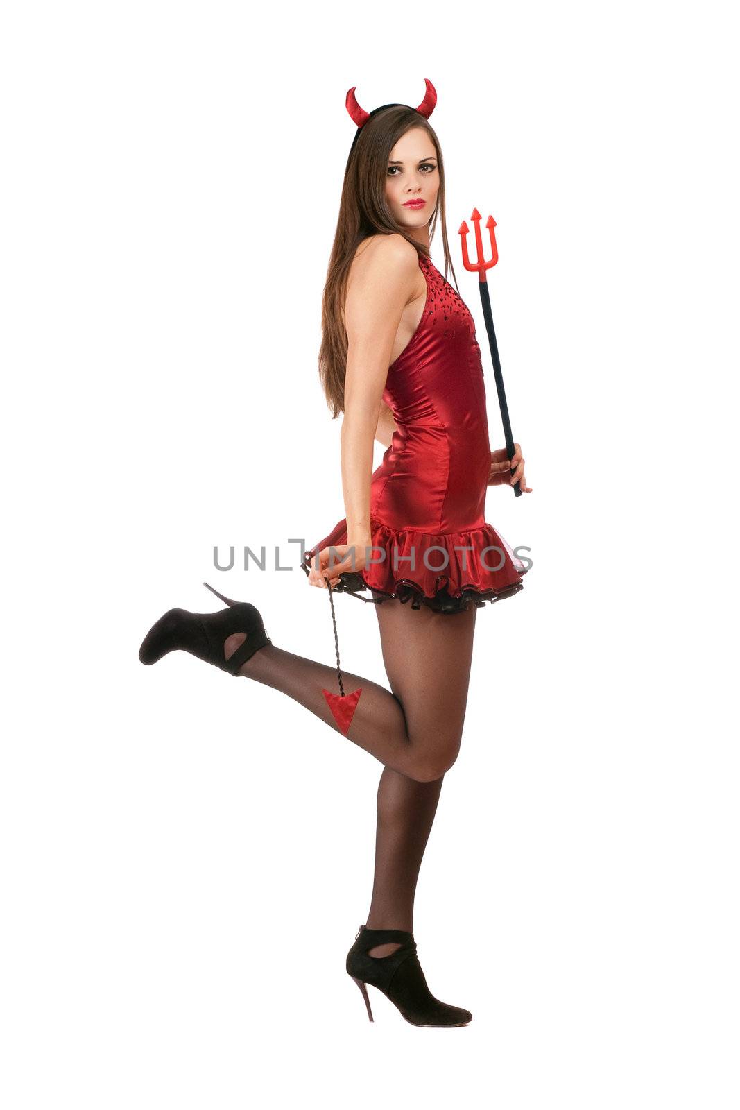 Playful young woman is wearing a sexy devil costume