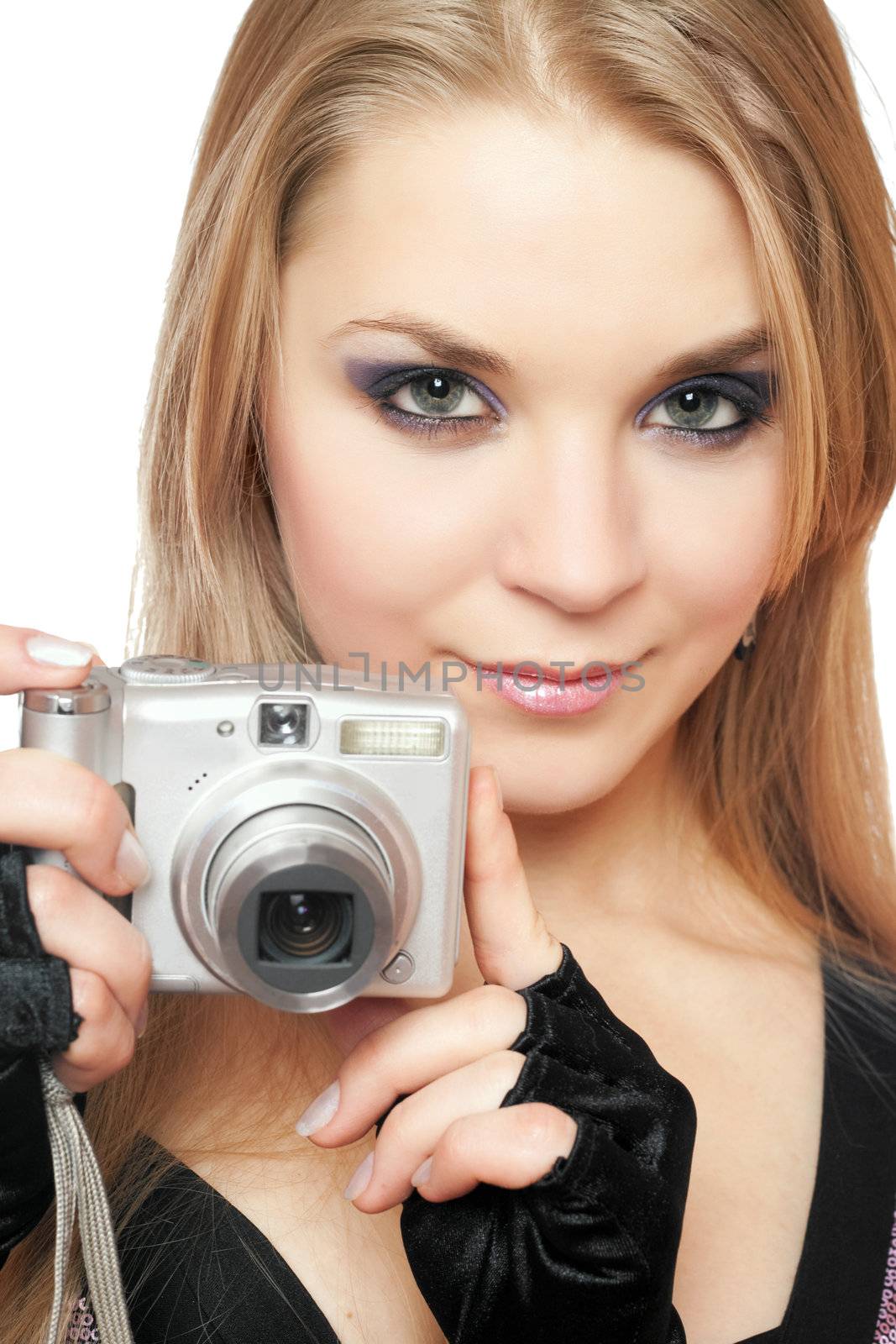 Young beautiful woman holding a photo camera. Isolated