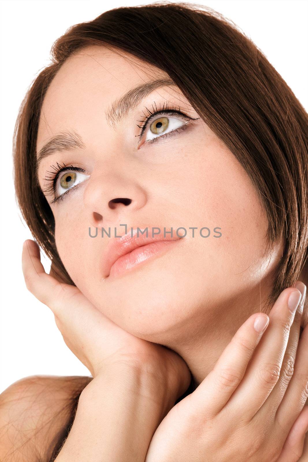 Closeup portrait of a dreamy girl. Isolated