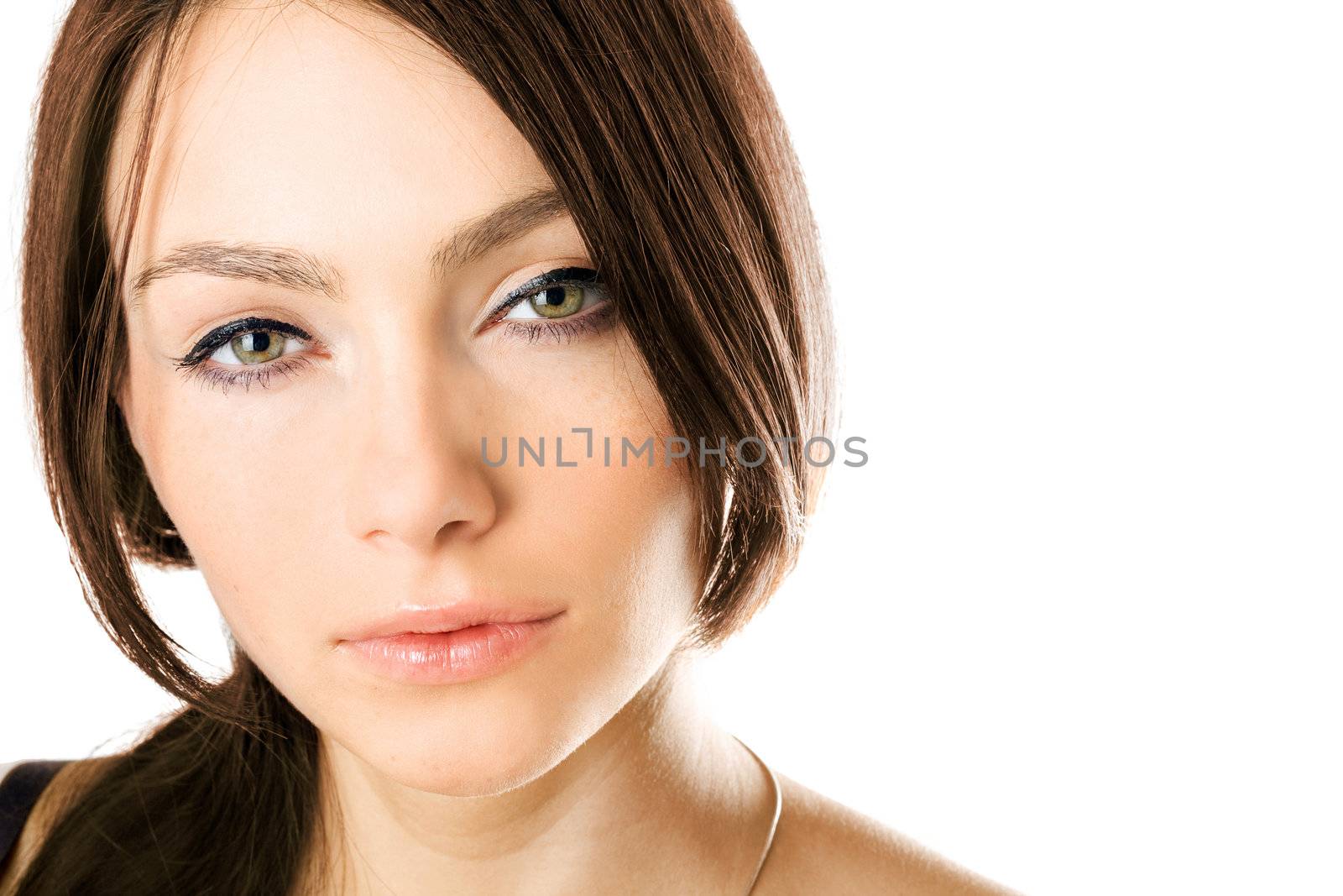 Closeup portrait of a beautiful young woman. Isolated