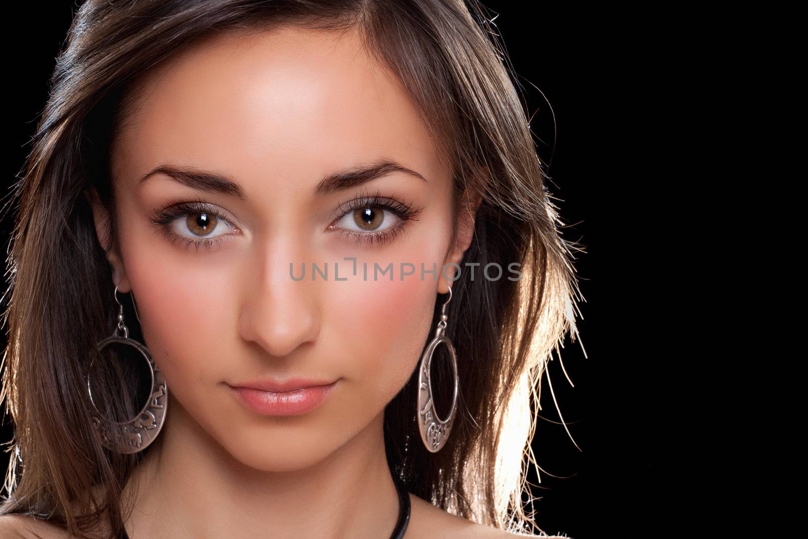 Closeup portrait of a young brunette. Isolated