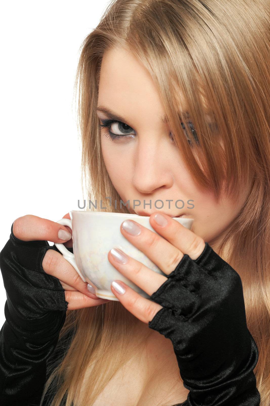 Beautiful young blonde with a cup of tea. Isolated on white