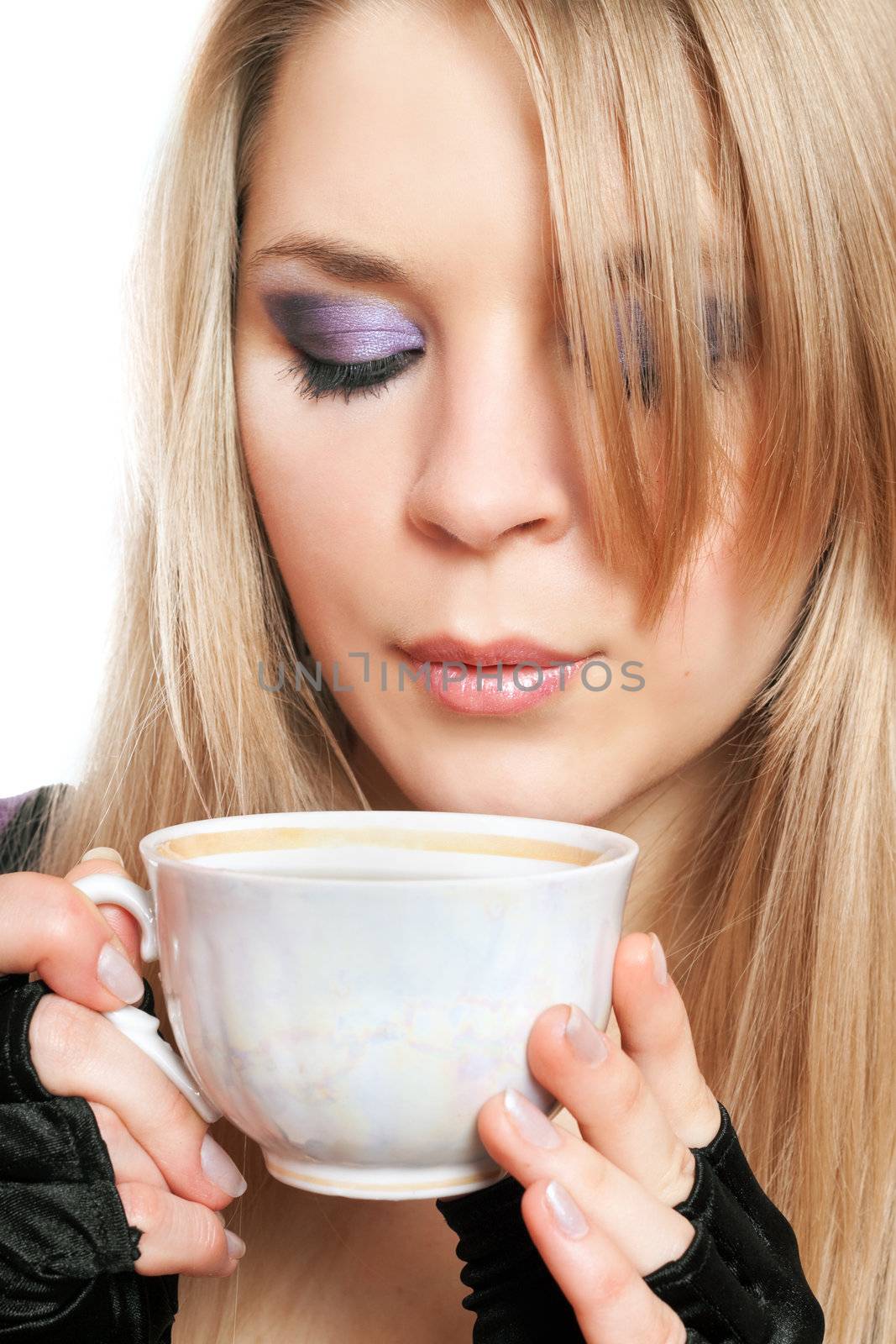 Beautiful blonde with a cup of tea. Isolated on white