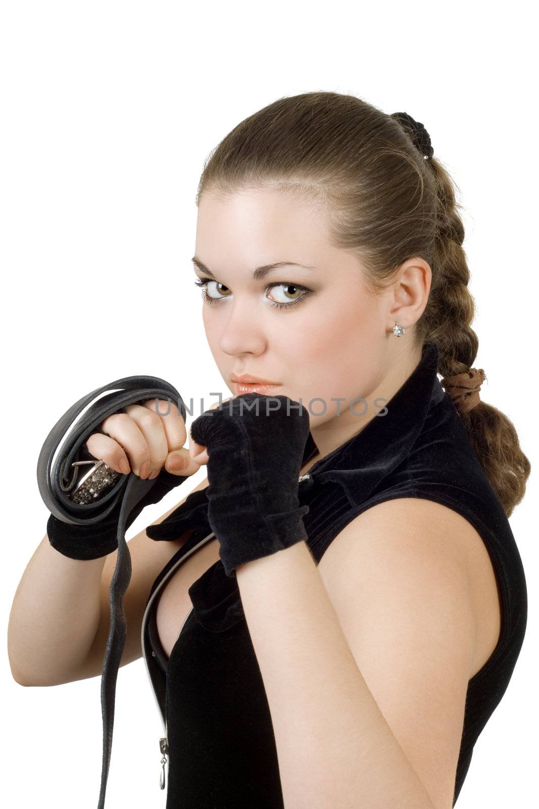 Pretty angry young woman throwing a punch. Isolated