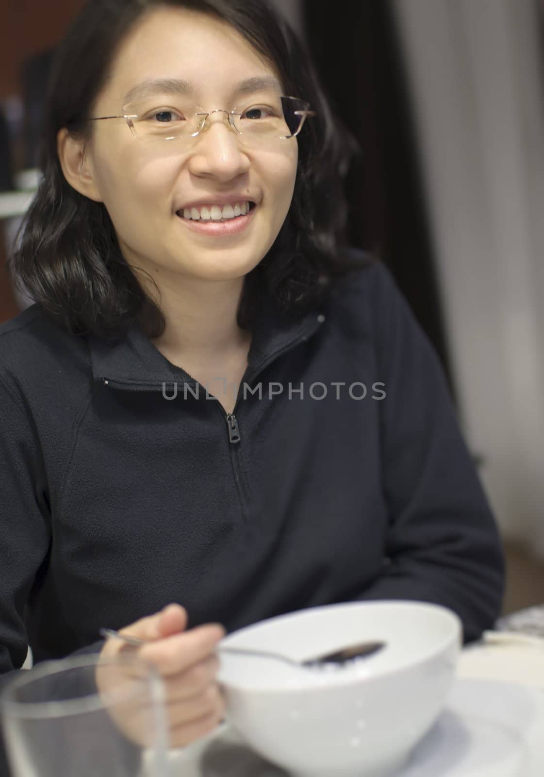 Woman drinking soup at restuarant