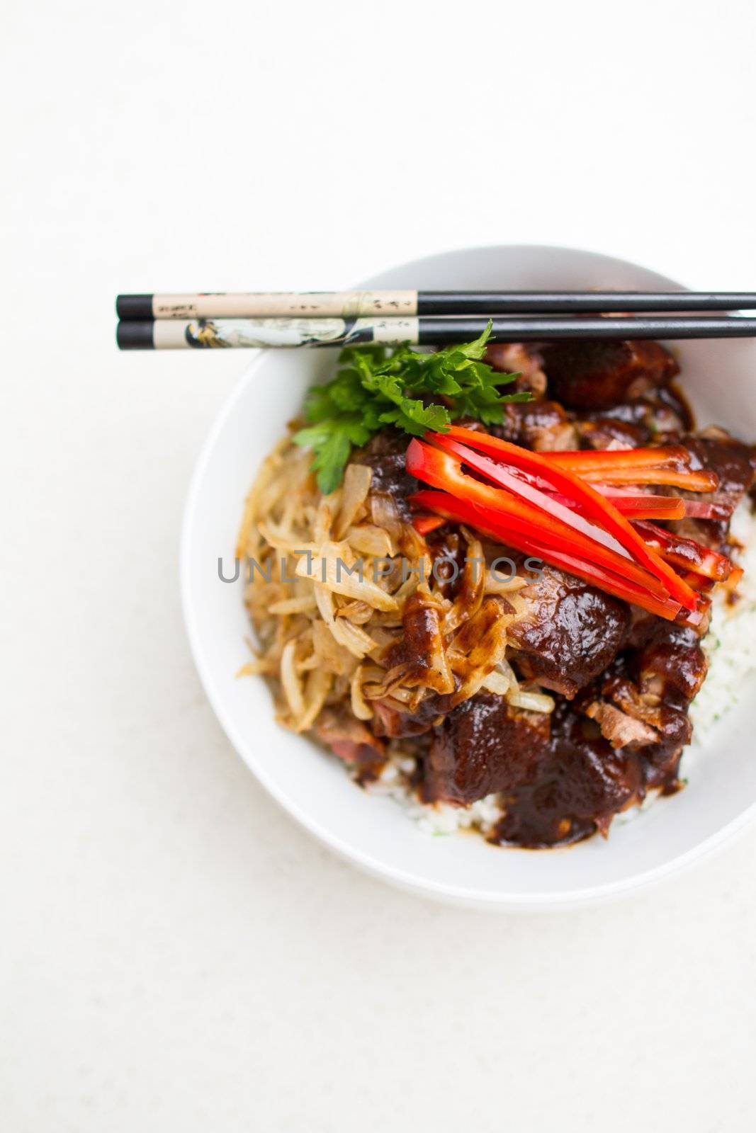 Japanese Steak Bowl with rice on white bowl and chopstick