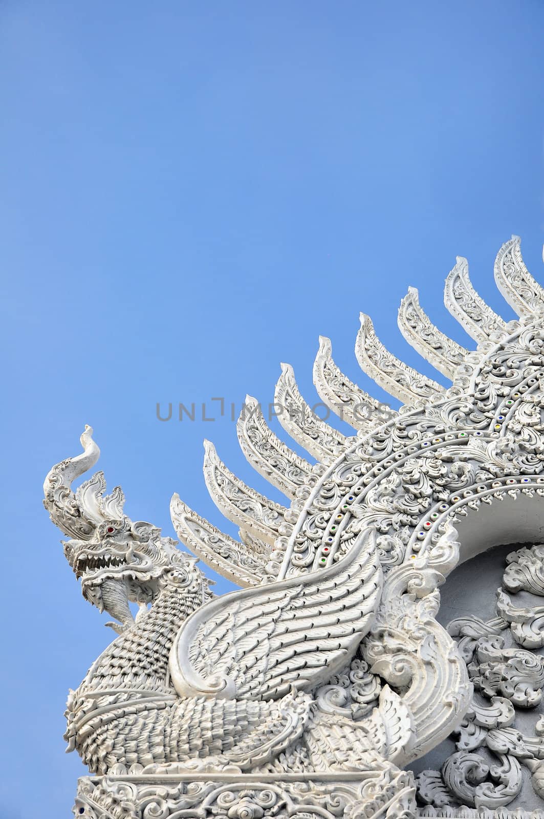 Creature statue on city pillar shrine of Nan district Thailand