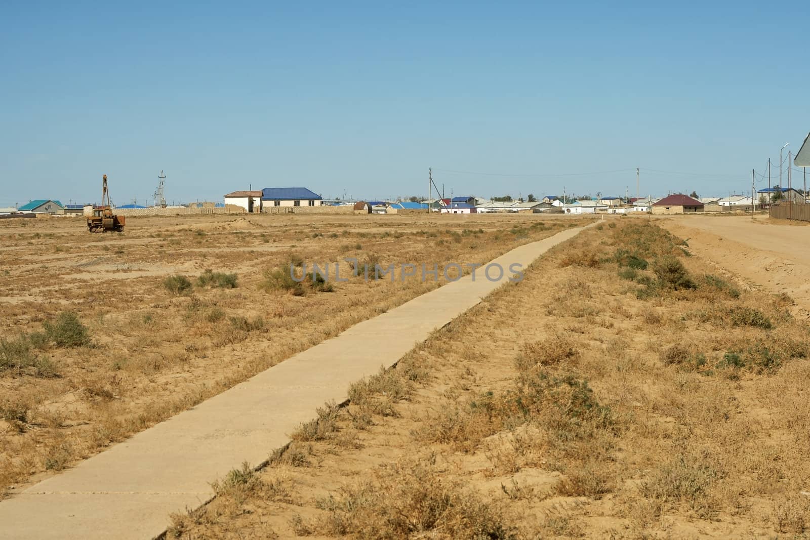 Concrete path towards the village "Opornyy"  Kazakhstan.